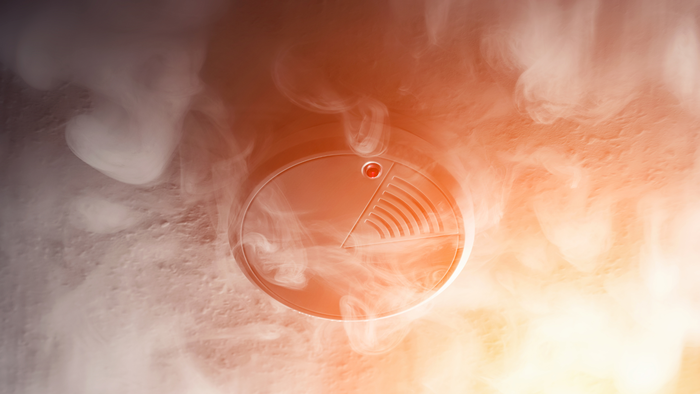 Fire alarm surrounded by smoke